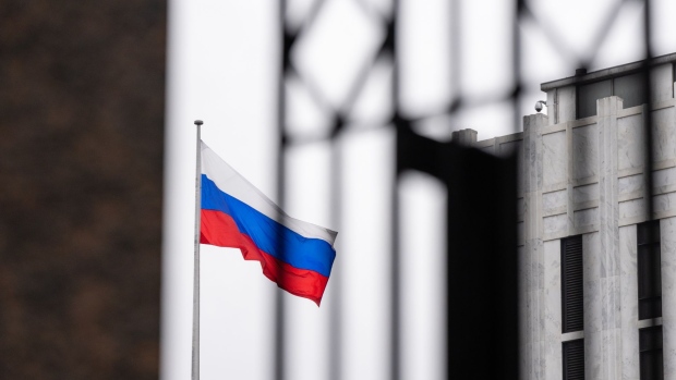 The Russian flag flies at the Russian Embassy in Washington, D.C., U.S., on Thursday, Feb. 24, 2022. Russia began a full-scale invasion of Ukraine after President Vladimir Putin vowed to “demilitarize” the country and replace its leaders.