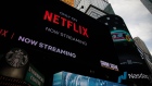 Netflix signage next to the Nasdaq MarketSite in New York, U.S., on Friday, Jan. 21, 2022. With the worst start of a year in more than a decade and a $2.2 trillion wipeout in market value, the Nasdaq Composite Index couldn’t have had a messier kickoff to 2022. Photographer: Michael Nagle/Bloomberg