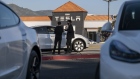 A Tesla dealership in Colma, California, U.S., on Wednesday, Jan. 26, 2022. U.S. auto sales will climb just 3.4% this year to 15.4 million cars and trucks as the semiconductor shortages continue to constrain vehicle inventory, auto dealers predict.