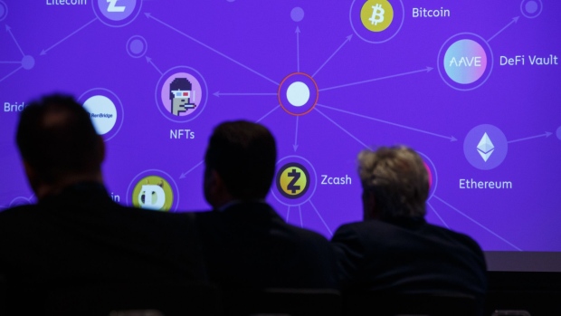 Audience members view crypto currency graphics during a presentation at the Chainalysis Links conference in London, U.K., on Thursday, Feb. 24, 2022. The conference is hosted by crypto research firm Chainalysis Inc. Photographer: Luke MacGregor/Bloomberg