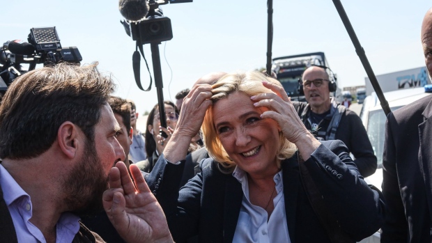 Marine Le Pen, nationalist presidential candidate, prepares to speak to voters during an election campaign event in Royes, France, on Thursday, April 21, 2022. With just four days to go until the French decide between two radically different visions for their future, opinion polls show there are still many undecided voters.