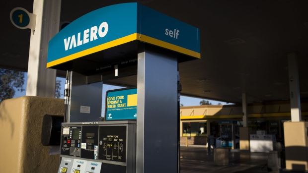 Signage is displayed on a fuel pump at a Valero Energy Corp. gas station in Phoenix, Arizona.