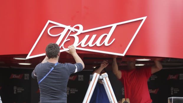 Workers prepare a logo promoting Bud beer, manufactured by Anheuser-Busch InBev SA, at a corporate pavilion during preparations ahead of the FIFA World Cup outside the Luzhniki stadium in Moscow, Russia, on Wednesday, June 13, 2018. According to an April report from the organizing committee, the total amount spent on preparations is 683 billion rubles, or about $11 billion at the current exchange rate. Photographer: Andrey Rudakov/Bloomberg