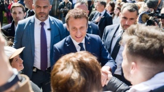 Emmanuel Macron, France's president, greets members of the public ahead of voting during the second round of the French presidential election, in Le Touquet, France, on Sunday, April 24, 2022. Macron is closer to winning another term at the helm of Europe’s second-largest economy as nationalist leader Marine Le Pen runs out of time to narrow the gap between them before the presidential runoff ballot on Sunday