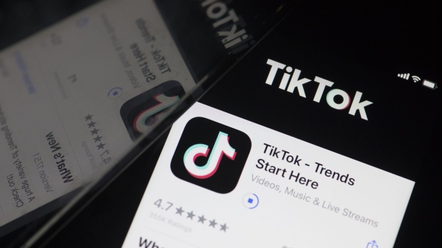 The download page for ByteDance Ltd.'s TikTok app is arranged for a photograph on a smartphone in Sydney.
