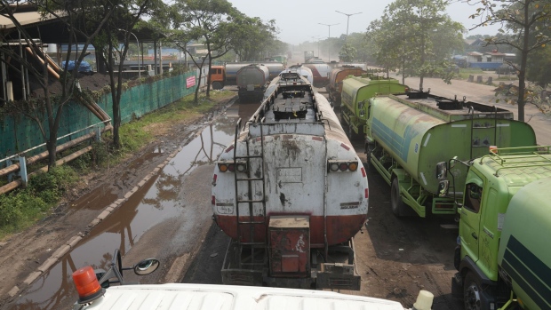Trucks to transport crude palm oil (CPO) queue outside an Apical Group Ltd. factory at Marunda in Jakarta, Indonesia, on Monday, April. 25, 2022. Palm oil slumped on prospects that top producer Indonesia’s surprise ban of cooking oil exports will not be strict as feared.