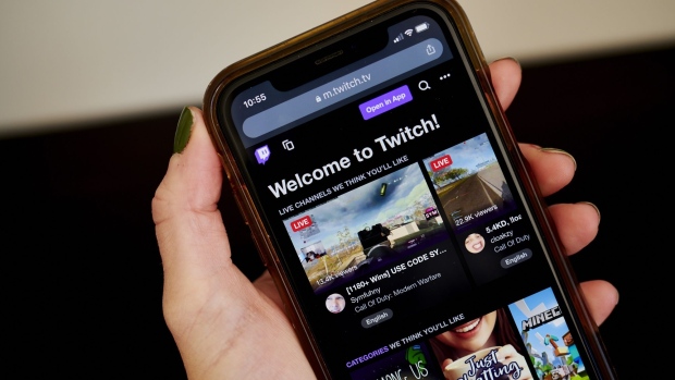 The website home screen for Twitch is displayed on a smartphone in an arranged photograph taken in Little Falls, New Jersey, U.S., on Thursday, Oct. 8, 2020. Twitch's market share of hours streamed jumped to 91% in the third quarter, up 15% from the second quarter, according to a report from streaming-software provider Streamlabs, which used data from Stream Hatchet.