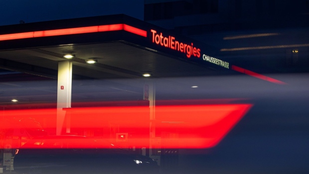 Signage for TotalEnergies SE at a gas station in Berlin, Germany, on Tuesday, March 15, 2022. Germany's Finance Minister Christian Lindner and the FDP want to compel gas-station operators to cap pump prices and the government would then compensate them directly for the lost revenue, according to an FDP official who asked not to be identified discussing confidential information. Photographer: Krisztian Bocsi/Bloomberg