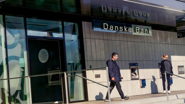 A logo sits on display in the window of a Danske Bank A/S bank branch in Copenhagen, Denmark, on Wednesday, Sept. 19, 2018. Danske Bank A/SChief Executive OfficerThomas Borgen will step down amid allegations his bank was at the center of a major European money laundering scandal with as much as $234 billion flowing through a tiny unit in Estonia. Photographer: Freya Ingrid Morales/Bloomberg