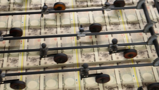 Sheets of Japanese 10,000 yen banknotes move through a machine at the National Printing Bureau Tokyo plant in Tokyo, Japan, on Monday, May 20, 2019. Japan’s unexpected growth spurt on the gross domestic product (GDP) in the first quarter masked weakness in the economy just as policy makers prepare to hike the sales tax in October. Photographer: Akio Kon/Bloomberg
