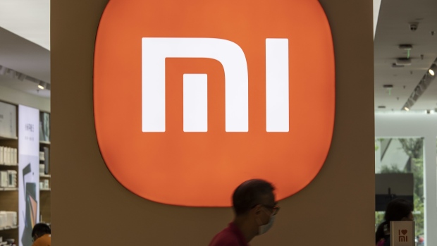 A shopper walks past a Xiaomi Corp. store in Shanghai, China, on Tuesday, Aug. 24, 2021. Xiaomi is scheduled to release earnings results on Aug. 25. Photographer: Qilai Shen/Bloomberg