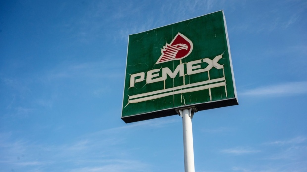 Signage is displayed outside a Petroleos Mexicanos (Pemex) gas station in Tepic, Nayarit state, Mexico, on Wednesday, April 22, 2020. Pemex has too much gasoline and nowhere to store it, potentially racking up significant ship fees as demand wanes because of the fast-spreading coronavirus. Photographer Cesar Rodriguez/Bloomberg Photographer: Cesar Rodriguez/Bloomberg
