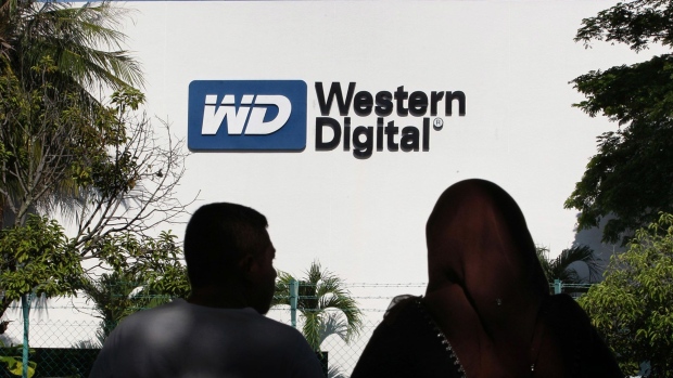 The Western Digital Corp. logo is displayed outside the company's factory in the Free Industrial Zone in Bayan Lepas, Penang, Malaysia. Photographer: Goh Seng Chong/Bloomberg