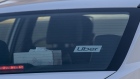 Uber signage on a vehicle at Oakland International Airport in Oakland, California, U.S., on Tuesday, Feb. 8, 2022. Uber Technologies Inc. is scheduled to release earnings figures on February 9. Photographer: David Paul Morris/Bloomberg