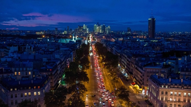 Traffic on Avenue de Neuilly in view of skyscrapers, ahead of national lockdown, in Paris, France, on Thursday, Oct. 29, 2020. Germany and France will clamp down on movement for at least a month, coming close to the stringent lockdowns in the spring as Europe seeks to regain control of the rapid spread of the coronavirus. Photographer: Nathan Laine/Bloomberg