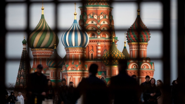 Pedestrians walk by Saint Basil's Cathedral on Red Square in Moscow, Russia, on Sunday, May 2, 2021. Facing a rising wave of Covid-19 infections and a vaccination rate that isn’t keeping up, the Kremlin is trying to contain the epidemic without alarming Russians. Photographer: Andrey Rudakov/Bloomberg