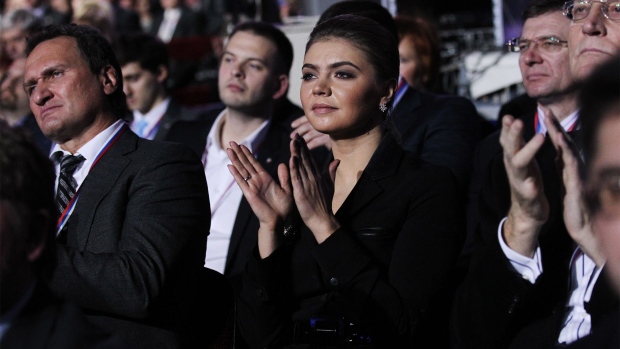Russian politician and former Olympic Champion, Alina Kabaeva, aplauds as Prime Minister Vladimir Putin (not pictured) delivers his speech at the congress of the United Russia Party November, 27, 2011 in Moscow, Russia.