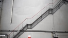 A staircase runs up the side of a storage silo at the Erik Walther GmbH oil terminal on the River Rhine in Schweinfurt, Germany, on Tuesday, June 11, 2019. Oil headed for a weekly decline as the tanker attacks in the Middle East provided only a relatively small boost to prices that have been hammered by a deepening trade war and swelling U.S. stockpiles. Photographer: Alex Kraus/Bloomberg