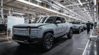 Rivian R1T electric vehicle pickup trucks on the assembly line.