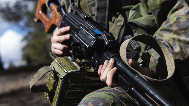 A soldier from Finnish Defence Forces holding a PK machine gun during the Finnish Army Arrow 22 training exercise, with participating forces from the U.K., Latvia, U.S. and Estonia, in Niinisalo, Finland, on May 4, 2022.