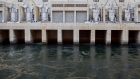 Water spills out of hydroelectric generators at the Hoover Dam in Boulder City, Nevada.