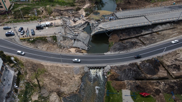 An aerial view shows the new road next to the destroyed bridge over the Irpin river on May 7, 2022 in Irpin, Ukraine.
