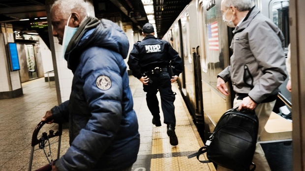 Police search for a suspect in a Times Square subway station following a call to police from riders on April 25, 2022 in New York City.