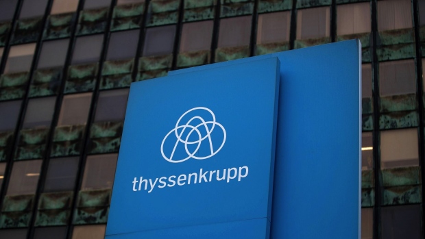 A logo on a sign at the Thyssenkrupp AG metals plant in Duisburg, Germany, on Monday, June 21, 2021. Weaning a low-margin industry off cheap coal and onto more costly green steel technologies will require massive government support and concerted action by steelmakers from Tangshan to Indiana. Photographer: Krisztian Bocsi/Bloomberg