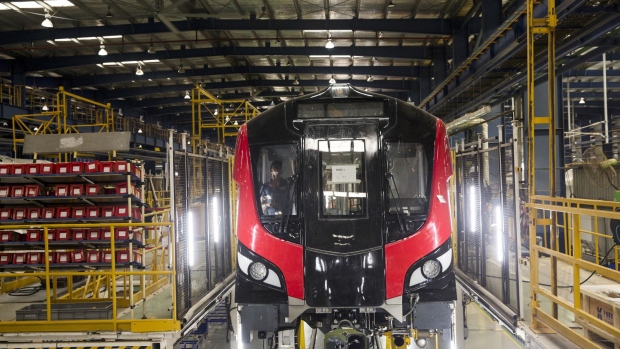 A worker labors inside a a Lucknow Metro Rail Corp. mass rapid transport (MRT) locomotive at the Alstom SA manufacturing facility in Sri City, Andhra Pradesh, India, on Tuesday, Aug. 14, 2018. Alstom -- which manufacturers trains in a number of categories: tram, metro, suburban/regional, high speed, very high speed, and locomotive -- makes around 45% of its revenue from sales of its trains. Photographer: Udit Kulshrestha/Bloomberg