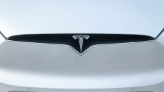 A Tesla Inc. badge is displayed on a Model X electric vehicle in San Ramon, California, U.S., on Saturday, Feb. 8, 2020. Tesla Chief Executive Officer Elon Musk is pushing the Solar Roof and batteries as essential components of the company's drive to reduce fossil fuel use. Photographer: David Paul Morris/Bloomberg