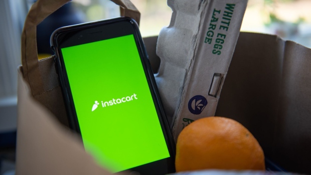 The Instacart logo on a smartphone arranged in Hastings-on-Hudson, New York, U.S., on Monday, Jan. 4, 2021. A booming market for U.S. initial public offerings shows no sign of slowing in 2021. Grocery-delivery company Instacart Inc. is preparing for a listing, according to people familiar with the matter. Photographer: Tiffany Hagler-Geard/Bloomberg