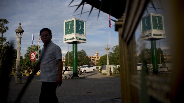 Manulife Financial Corp. signage is displayed on a clock in Battambang, Cambodia, on Monday, Aug. 7, 2017. The Association of Southeast Asian Nations (ASEAN) has much to crow about as it marks its 50th anniversary: economic and social progress, a manufacturing powerhouse and relative political stability.