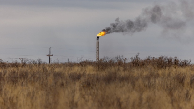 A natural gas flare stack at an oil well in Midland, Texas, U.S. on Monday, April 4, 2022. West Texas, the proud oil-drilling capital of America, is now also on the cusp of becoming the earthquake capital of America. Photographer: Jordan Vonderhaar/Bloomberg