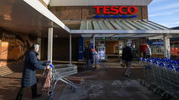 Customers enter a Tesco Plc supermarket in Chelmsford, U.K., on Wednesday, Jan. 12, 2022. U.K. retailers so far have largely been saying they fared well through the holiday season.