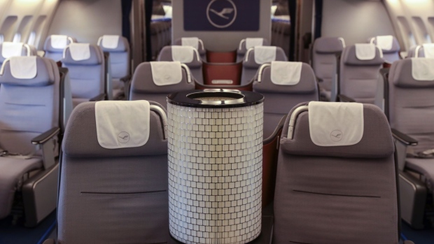 A Hepa filter air conditioner unit between empty business class seats on a grounded Airbus SE A340 passenger aircraft, operated by Deutsche Lufthansa AG, in Frankfurt, Germany, on July 30, 2020. 