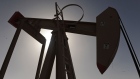 Oil rose to $100 a barrel in New York for the first time since May as the Federal Reserve pledged further economic stimulus, while unrest in the Middle East and North Africa fanned concern that supplies will be threatened.