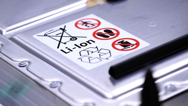 A recycling symbol and handling instructions sit on a lithium-ion automotive battery pack for a Volkswagen AG (VW) ID.3 electric automobile at the automaker's factory in Zwickau, Germany, on Tuesday, Feb. 25, 2020. The world’s largest automaker plans to eliminate carbon dioxide emissions by 2050 and will invest 33 billion euros through 2024 to build the industry’s biggest fleet of electric cars. Photographer: Krisztian Bocsi/Bloomberg