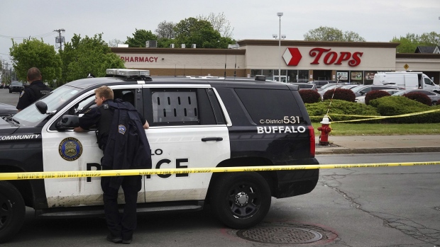 BUFFALO, NEW YORK - MAY 16: Police and FBI agents continue their investigation of the shooting at Tops Market on May 16, 2022 in Buffalo, New York. A gunman opened fire at the store yesterday killing ten people and wounding another three. The attack was believed to be motivated by racial hatred. (Photo by Scott Olson/Getty Images)