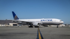 A United Airlines Holdings Inc. Boeing 777-200 aircraft taxiing on the tarmac at San Francisco International Airport (SFO) in San Francisco, California, U.S., on Thursday, Oct. 15, 2020. United and Hawaiian Airlines are offering options for Covid-19 testing to passengers traveling to the state of Hawaii that will include at-home tests, drive-through testing, and in-person tests at the airport. Photographer: David Paul Morris/Bloomberg