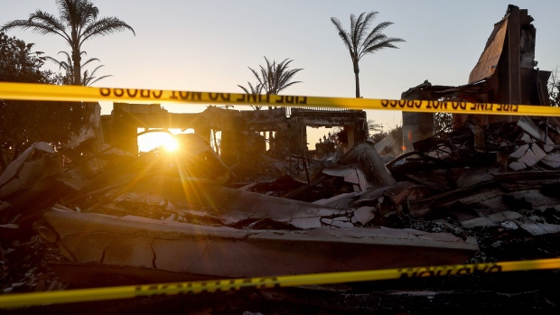 LAGUNA NIGUEL, CALIFORNIA - MAY 12: The sun begins to set beyond one of over 20 homes destroyed by the Coastal fire on May 12, 2022 in Laguna Niguel, California. The brush fire was fueled by windy and dry conditions amid California’s severe drought which has been compounded by climate change. (Photo by Mario Tama/Getty Images)