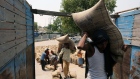 Laborers loading up wheat sacks on a truck at the grain market in the Khanna district of Punjab, India, on Saturday, April 30, 2022. A blistering heat wave has scorched what fields in India, reducing yields in the second-biggest grower and damping expectations for exports that the world is relying on to alleviate a global shortage.