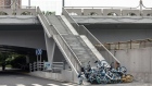 Shared bicycles form a temporary barricade at an entrance to a bridge during a lockdown in Shanghai. Source:  /Bloomberg