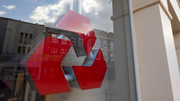 A sign in the window of a NatWest Group Plc bank branch in Chelmsford, U.K., on Friday, Feb. 11, 2022. European banks have largely thrived in the pandemic thanks to a flurry of dealmaking and unprecedented taxpayer support for the economy. Photographer: Chris Ratcliffe/Bloomberg