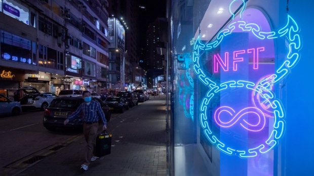 An illuminated neon sign of an NFT displayed in Hong Kong, China, on Friday, Feb. 4, 2022. Hong Kong may look to tighten social distancing measures as coronavirus cases balloon and threaten to overwhelm the city’s health-care system. Photographer: Paul Yeung/Bloomberg