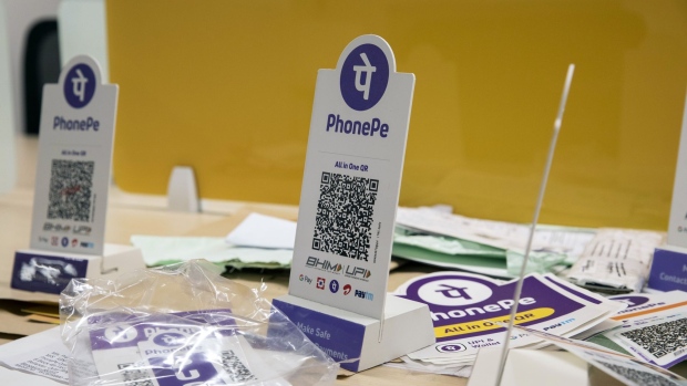 Advertisements and QR codes sit on a desk at the PhonePe headquarters in Bengaluru, India, on Tuesday, Sept. 28, 2021. As online payments and digital loans in the second-most populous country soar at some of the fastest rates worldwide, money is pouring into India’s financial technology sector at an unprecedented pace.