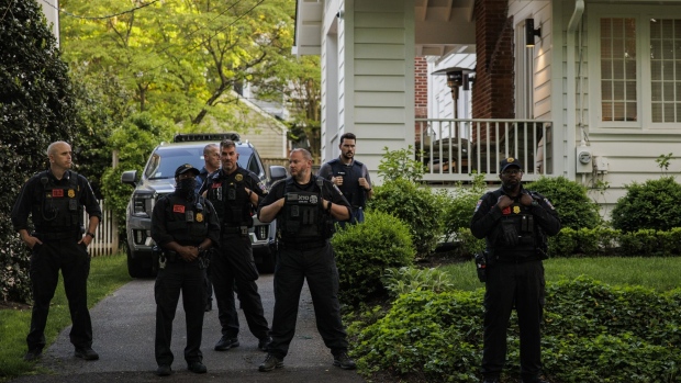 Law enforcement officers stand outside the home of Supreme Court Justice Brett Kavanaugh in Chevy Chase, Maryland, US, on Wednesday, May 11, 2022. Senate Democrats were blocked in their attempt to enshrine abortion rights in federal law in a vote that highlighted both the deep divide on the politically explosive issue and the party's schism over ending the filibuster to achieve their goals.