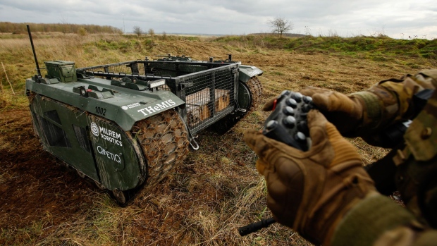 Owen Stringer, a rifleman in the British Army, operates a Tracked Hybrid Modular Infantry System, THeMIS, developed by Milrem Robotics and QinetiQ Group Plc, at the Autonomous Warrior 18 military exercise in Salisbury, U.K.