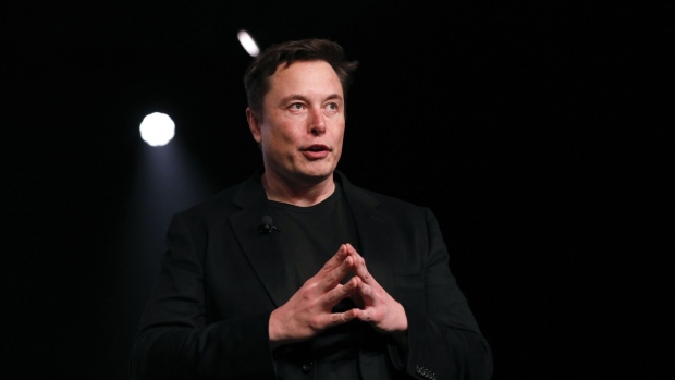 Elon Musk, co-founder and chief executive officer of Tesla Inc., speaks during an unveiling event for the Tesla Model Y crossover electric vehicle in Hawthorne, California, U.S., on Friday, March 15, 2019. Musk said the cheaper electric crossover sports utility vehicle (SUV) will be available from the spring of 2021. The vehicle's price will start at $39,000, a longer-range version will cost $47,000.