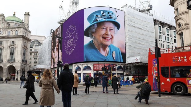 A portrait of Queen Elizabeth II is displayed on the large screen at Piccadilly Circus to mark the start of the Platinum Jubilee on February 6, 2022 in London. Photographer: Hollie Adams/Getty Images