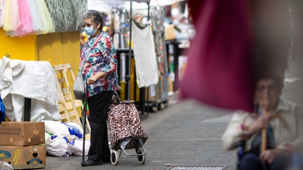A customer browses stalls at a street market in London, UK, on Tuesday, May 17, 2022. The Office for National Statistics will release U.K. CPI Inflation figures for April on Wednesday.